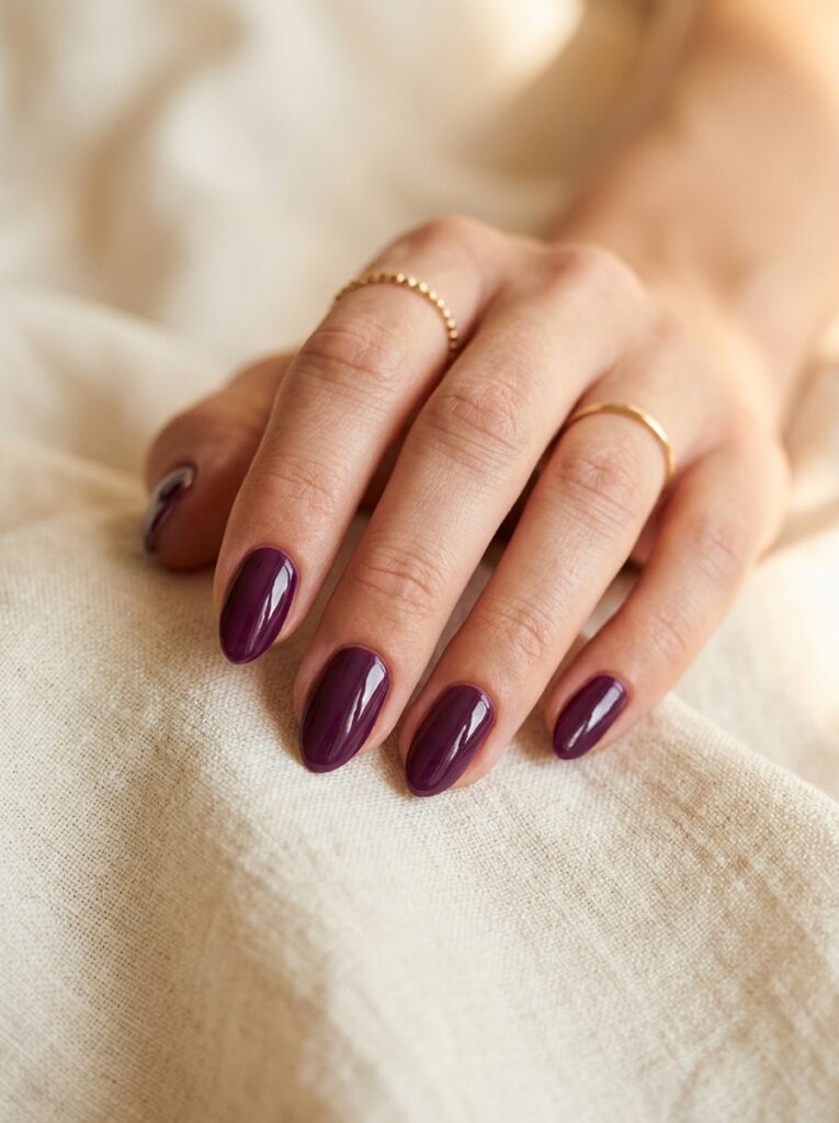 20 Stunning Plum Nail Ideas You'll Want to Save This Fall glossy plum nails almond shape fall manicure