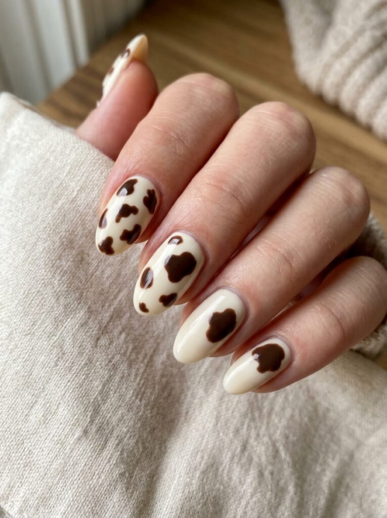 30 Cute Fall Nail Ideas for 2026 That Are Worth Copying cow print closeup nails