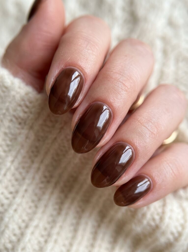 fingernails with chocolate brown… 202607141057