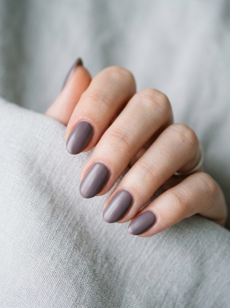 20 Stunning Plum Nail Ideas You'll Want to Save This Fall muted dusty plum nails quiet luxury