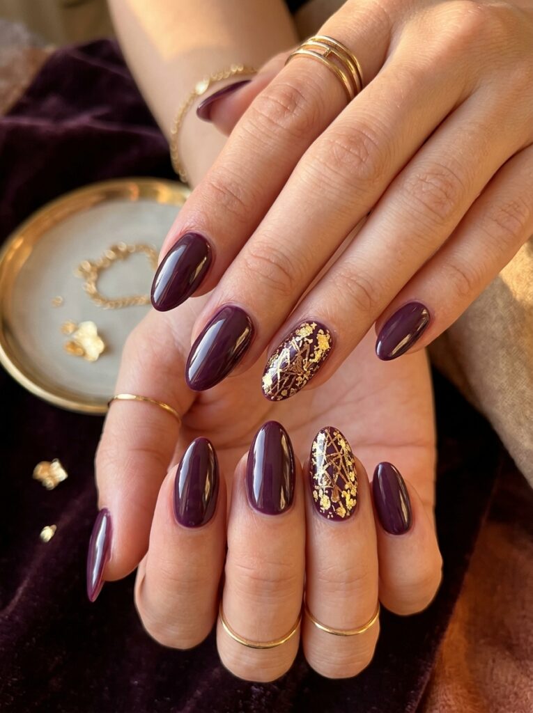 20 Stunning Plum Nail Ideas You'll Want to Save This Fall plum nails with gold foil flakes