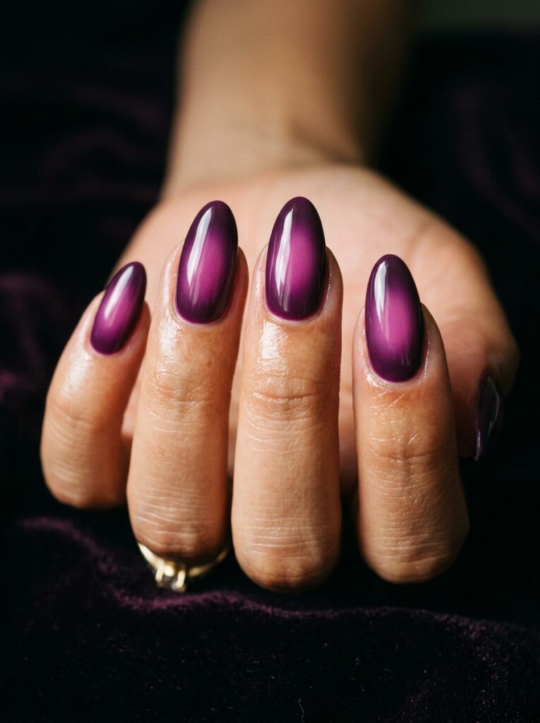 20 Stunning Plum Nail Ideas You'll Want to Save This Fall plum aura nails airbrushed glow