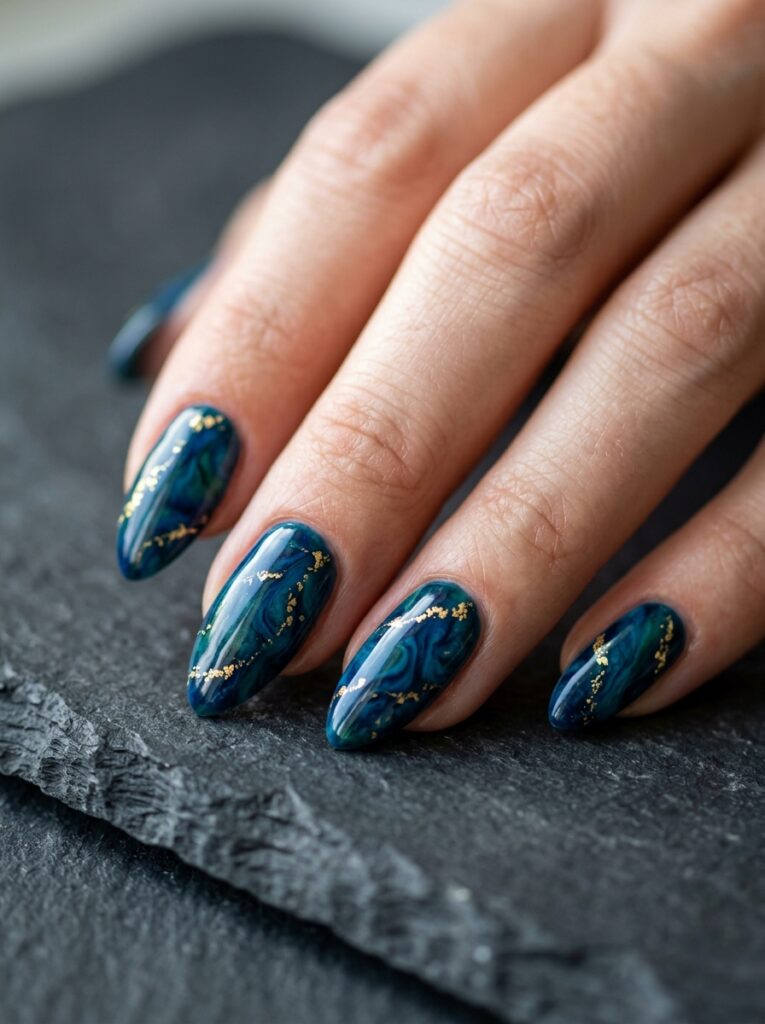 peacock blue marble nails with gold foil