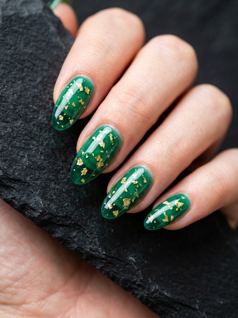 sheer emerald jelly nails with gold flakes