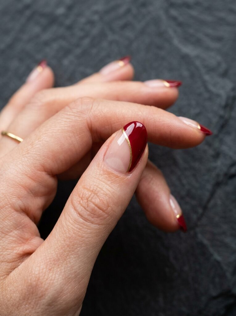 gilded edge minimalist red negative space nails
