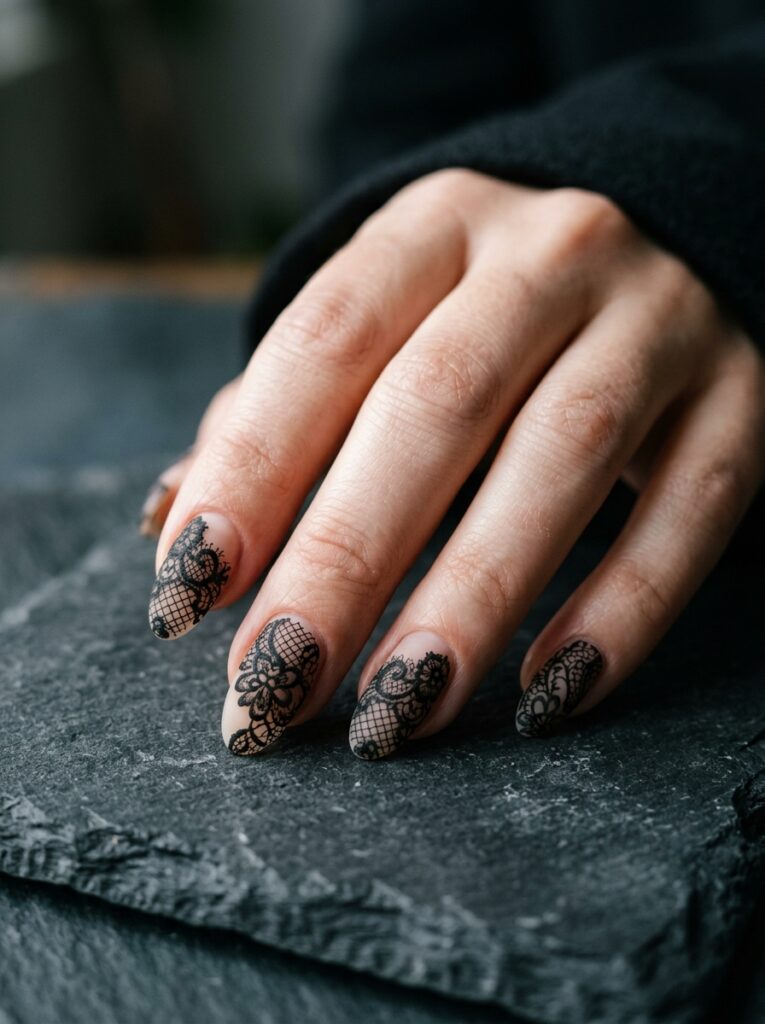 gothic matte black lace nails on sheer nude