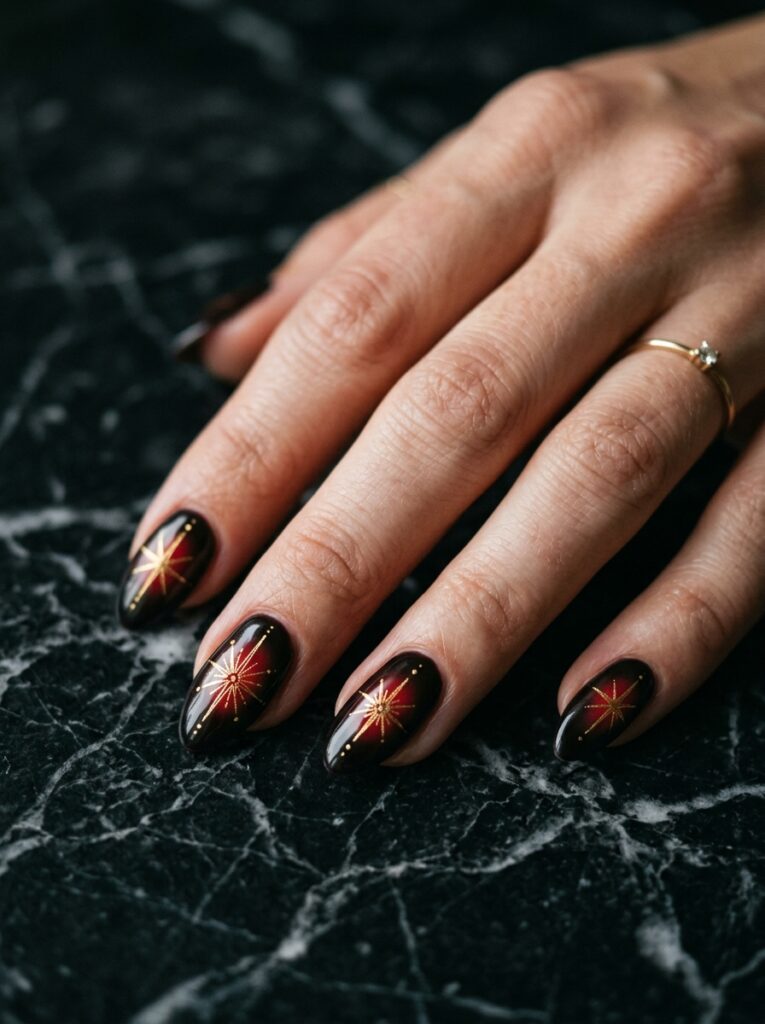 blurred crimson aura nails with starbursts