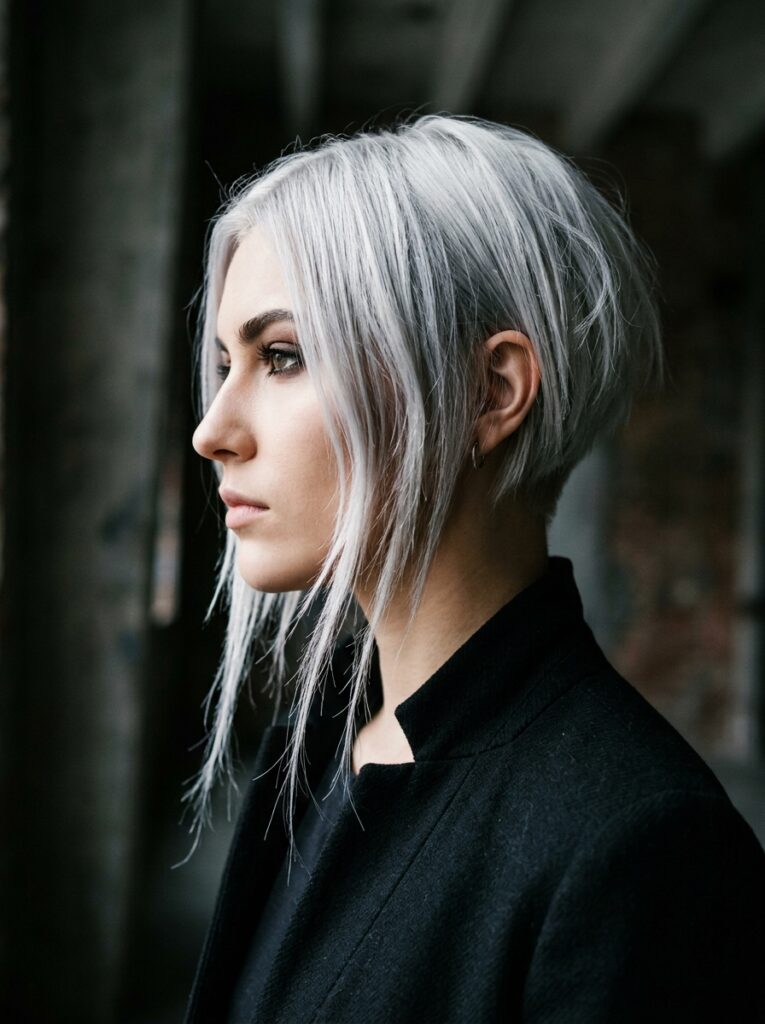 Platinum silver asymmetrical razor-cut bob.
