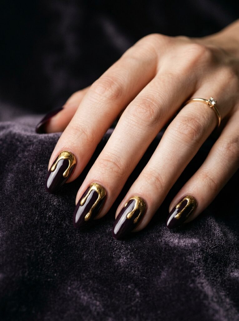 midnight plum nails with molten gold drips