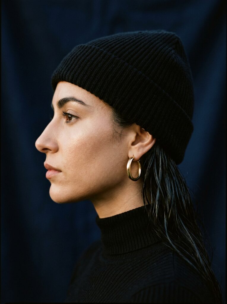 beanie with wet look slicked back hair