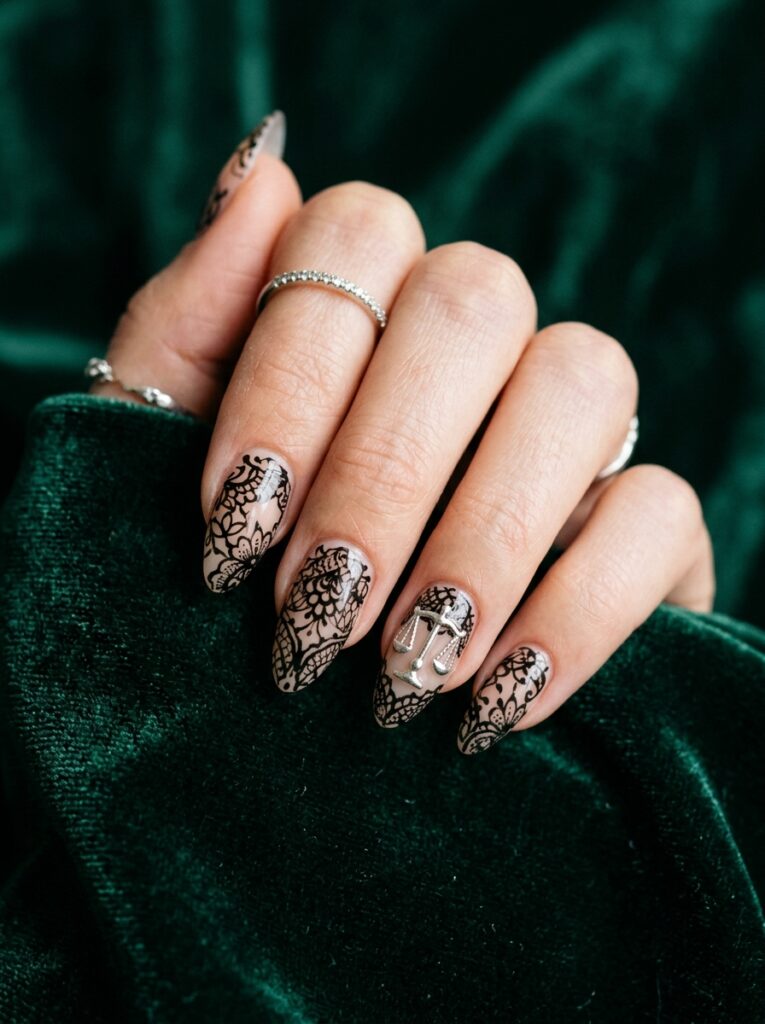black lace nails with silver balance scale accent