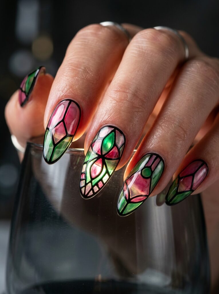 stained glass nail art in pink and green with black outlines